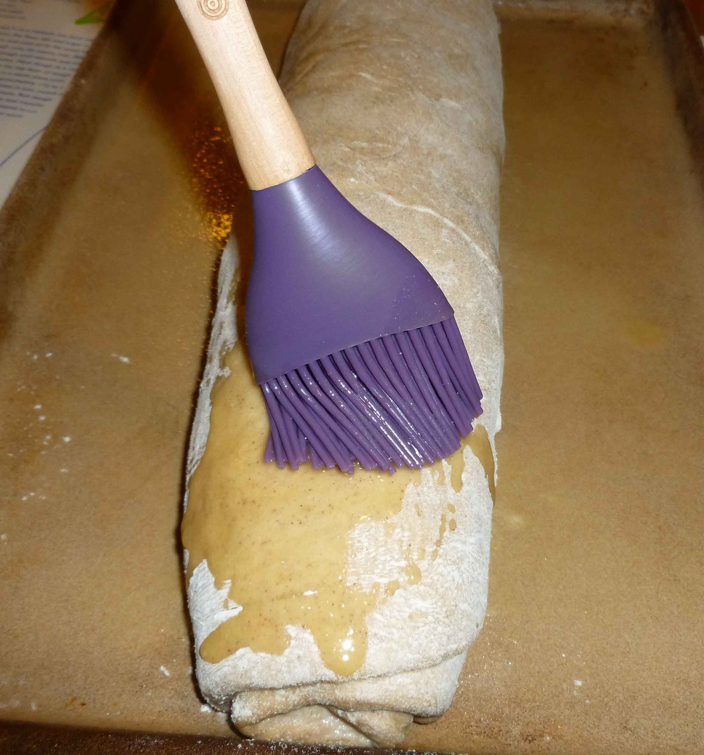 Brushing Melted Earth Balance over Bread Roll