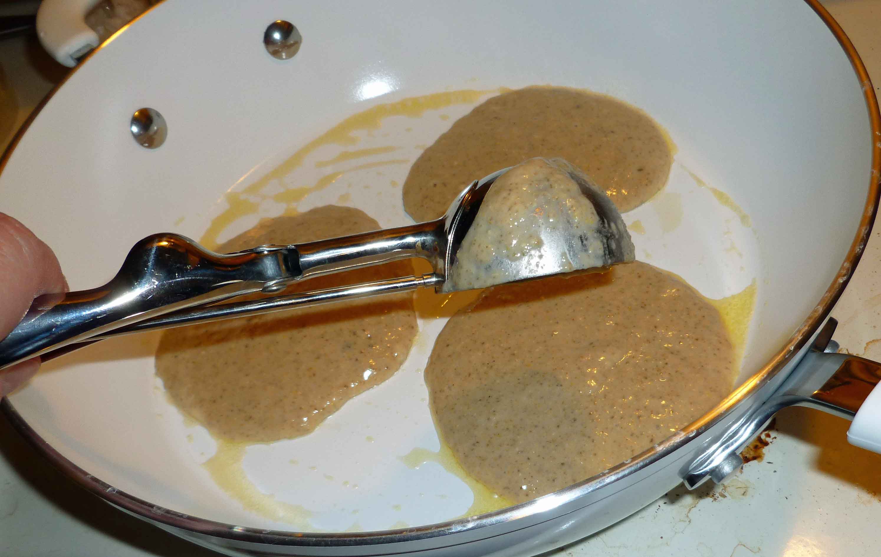 Portioning out batter into skillet