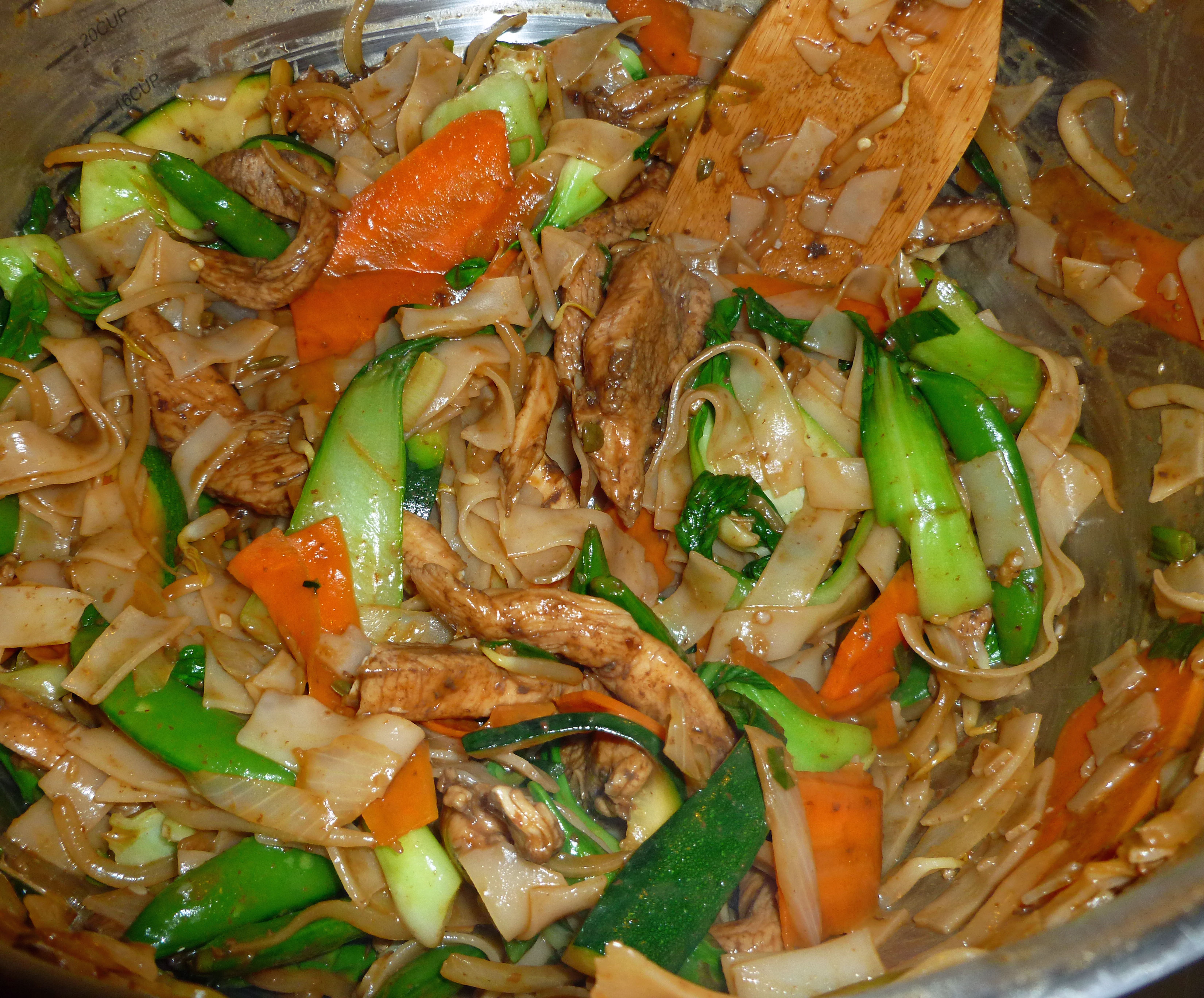 All cooked ingredients being mixed in bowl