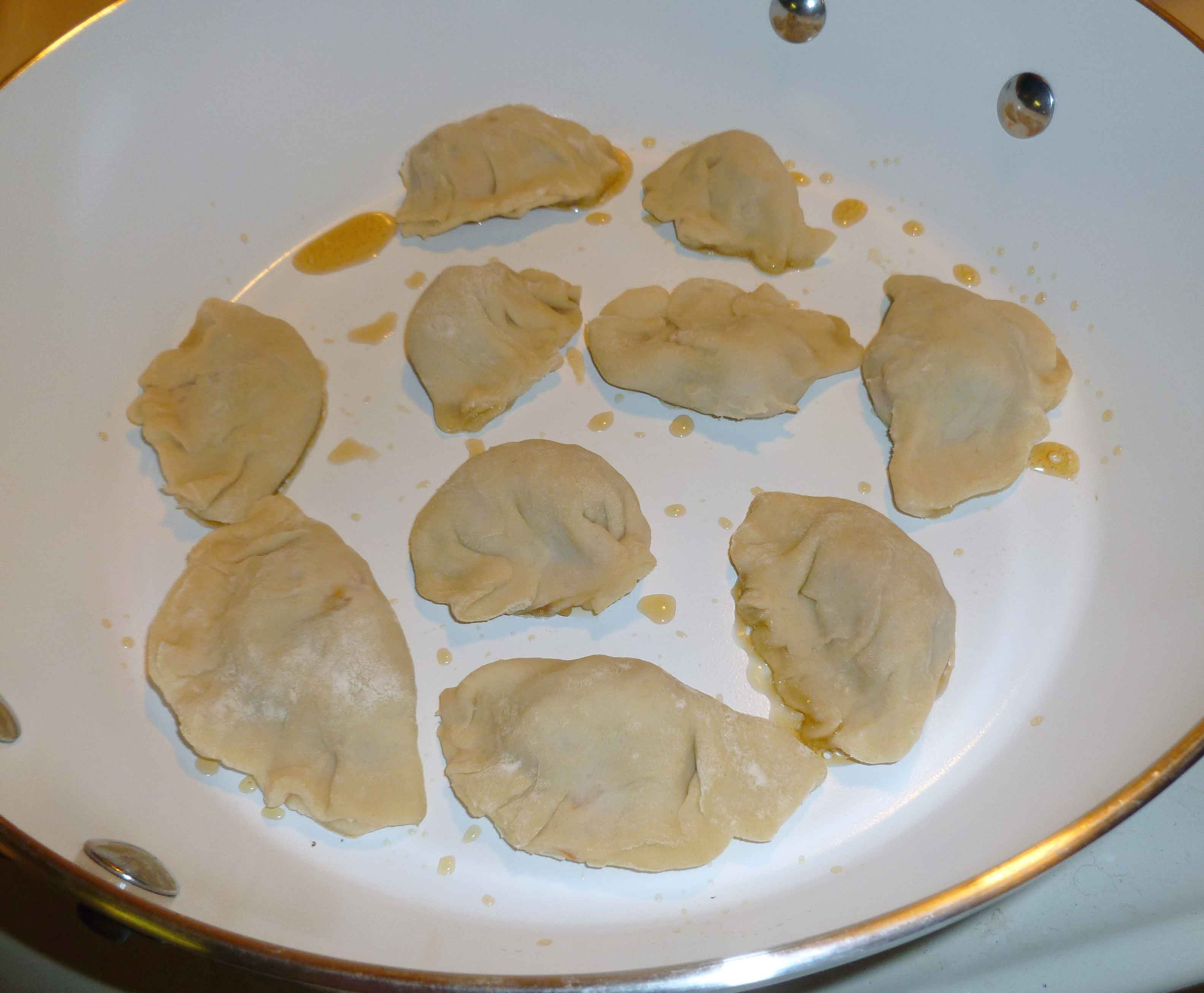 Dumplings properly spaced in skillet