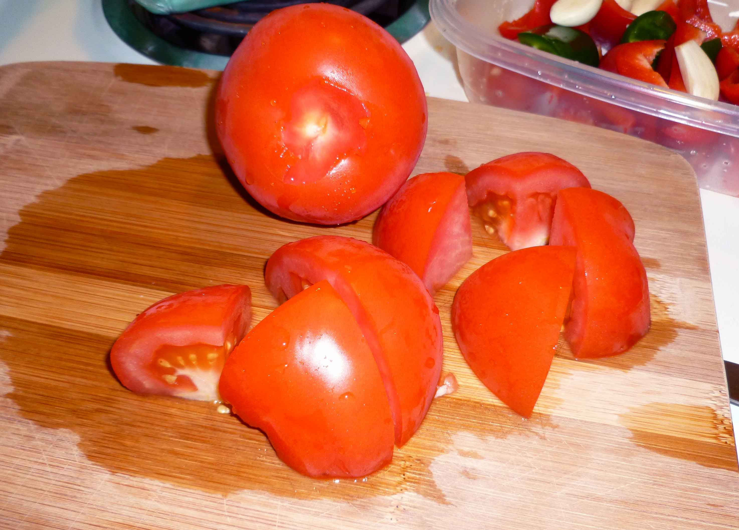 Tomatoes, showing cored and cut into eighths