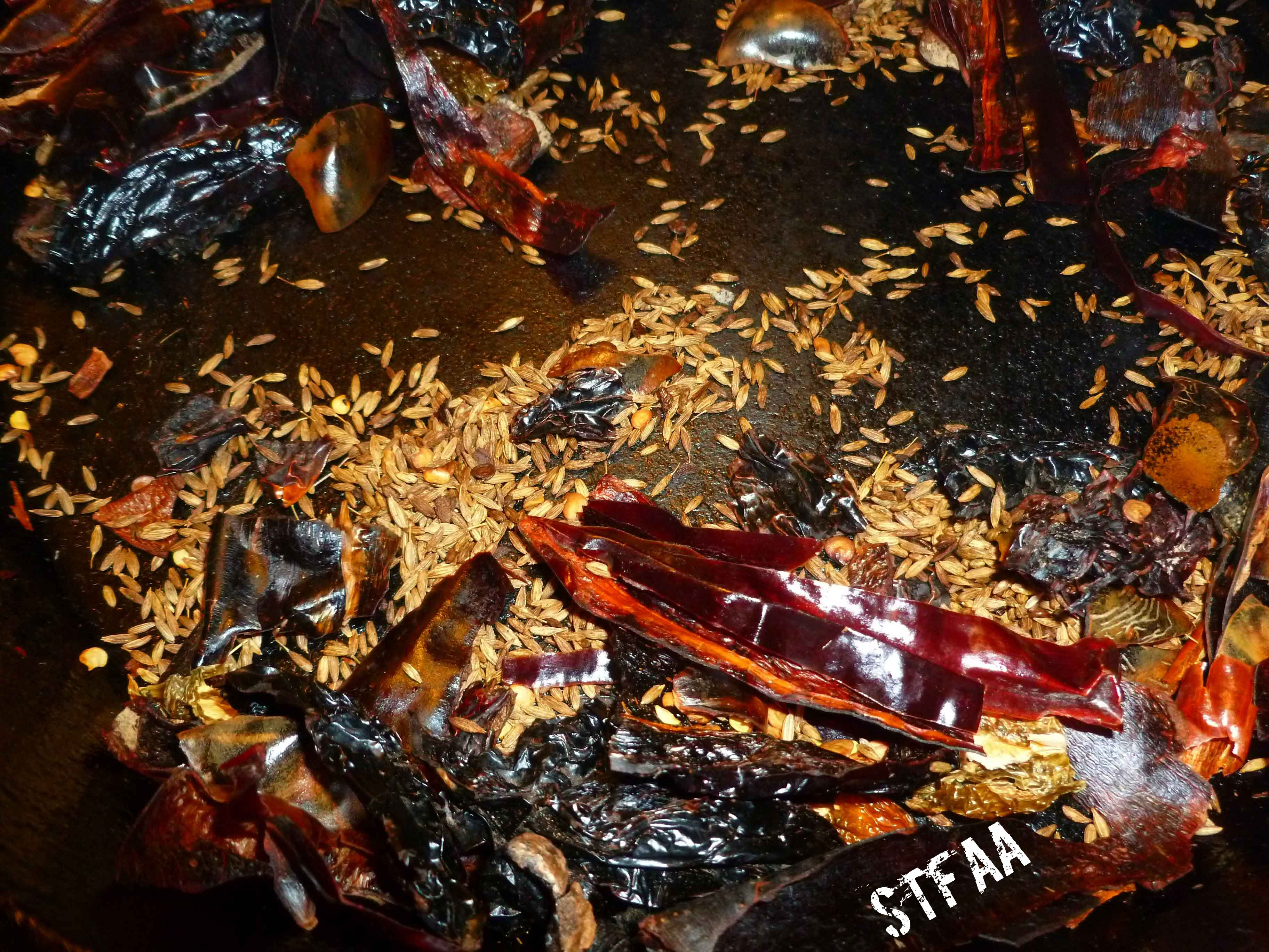 Dried chiles and cumin seed after toasting