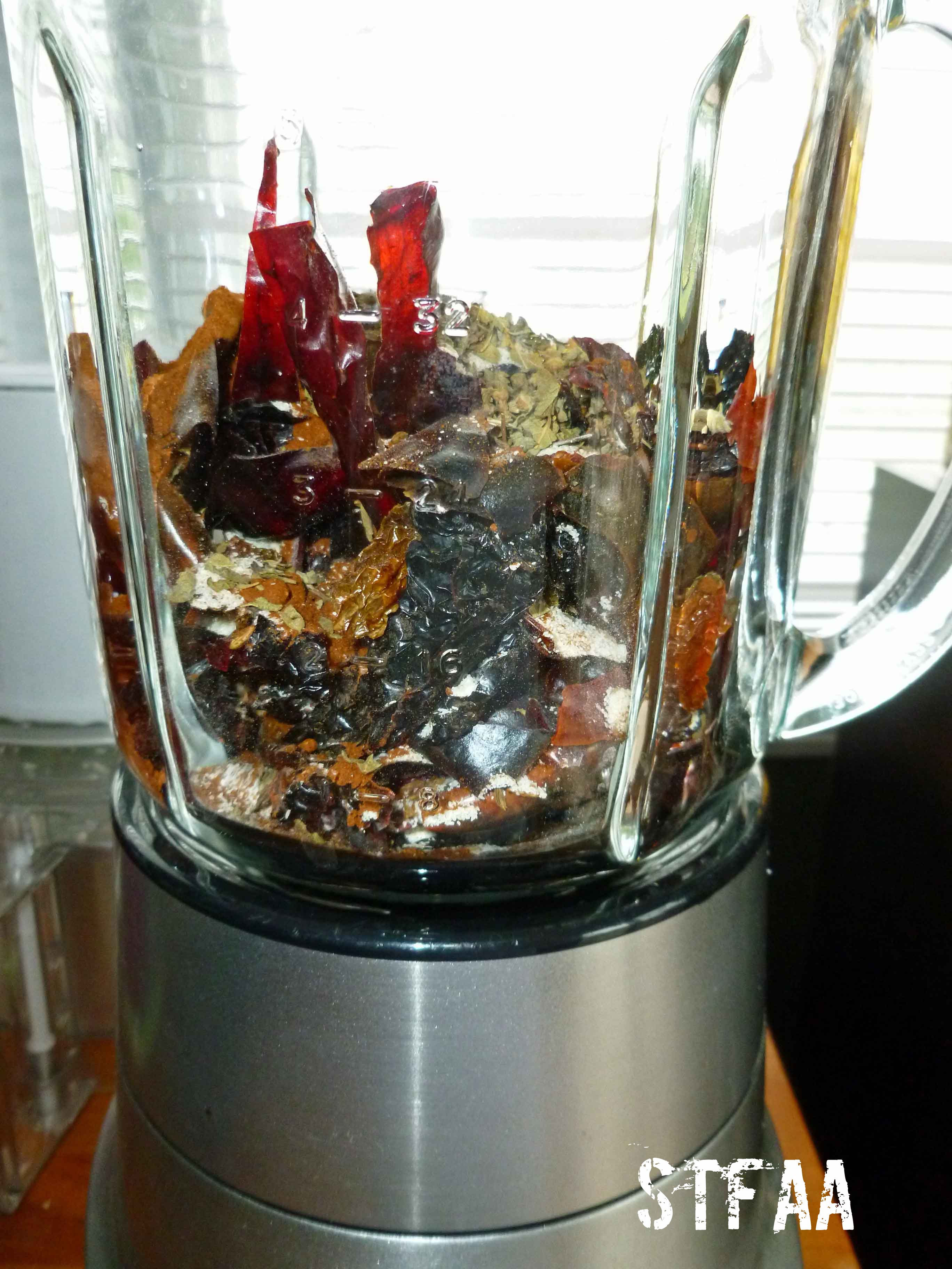 Dried chiles, cumin seed, garlic powder, oregano and paprika in blender