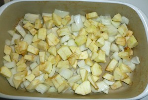 Apples and onions in roasting pan