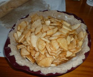 Apples placed in pie pan