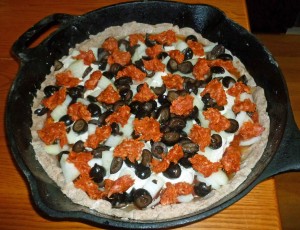 Pizza with toppings before baking