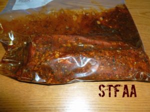 Steak tips in marinade in zip top bag