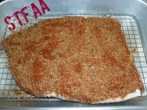 Brisket on rack in roasting pan