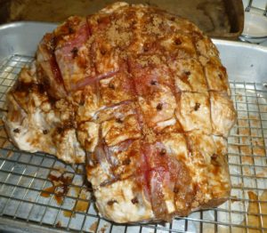 Ham after rub and cloves inserted before cooking