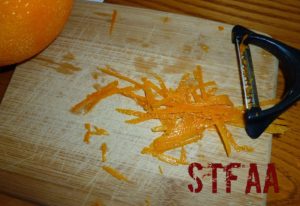 Using a julienne peeler to zest the oranges