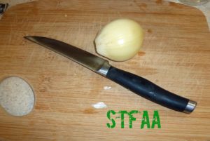 One clove of the elephant garlic MaryKate sent me with a steak knife for size reference