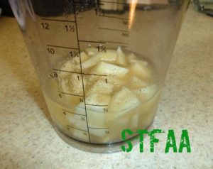 Garlic, salt, aquafaba, water, and lemon juice before blending