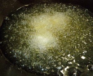 Frying the stuffed potatoes