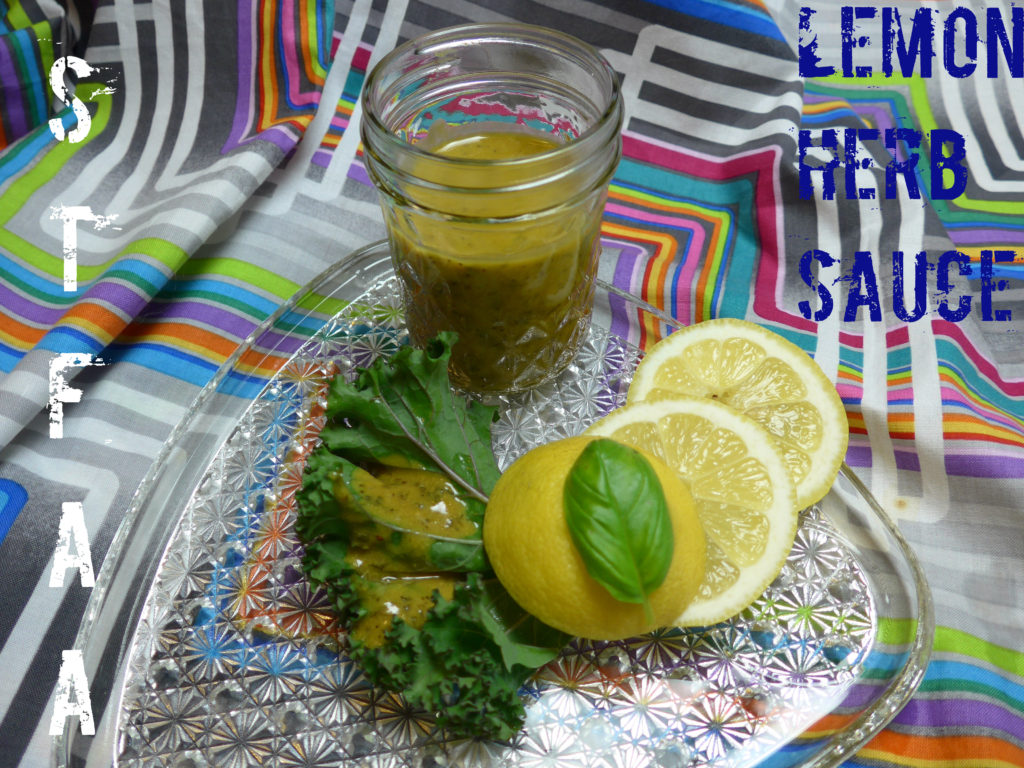 lemon herb sauce drizzled over a kale leaf propped up on lemon slices and basil