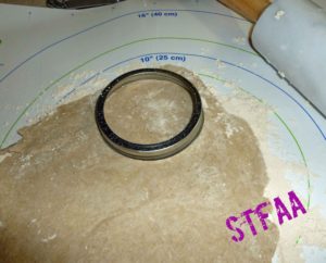 Using a canning ring to cut the bottom crust