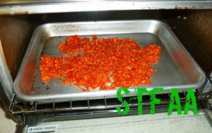 Wet chili skin and seeds going into a toaster oven