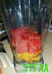 Peppers, grapefruit pulp, and garlic in blender