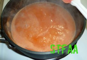 Onion and pepper mixtures combined and brought to a gentle boil