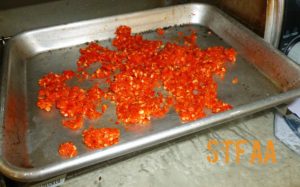 Strained out pepper skin and seeds before drying in the oven