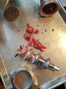 The meat left in the grinder after grinding 